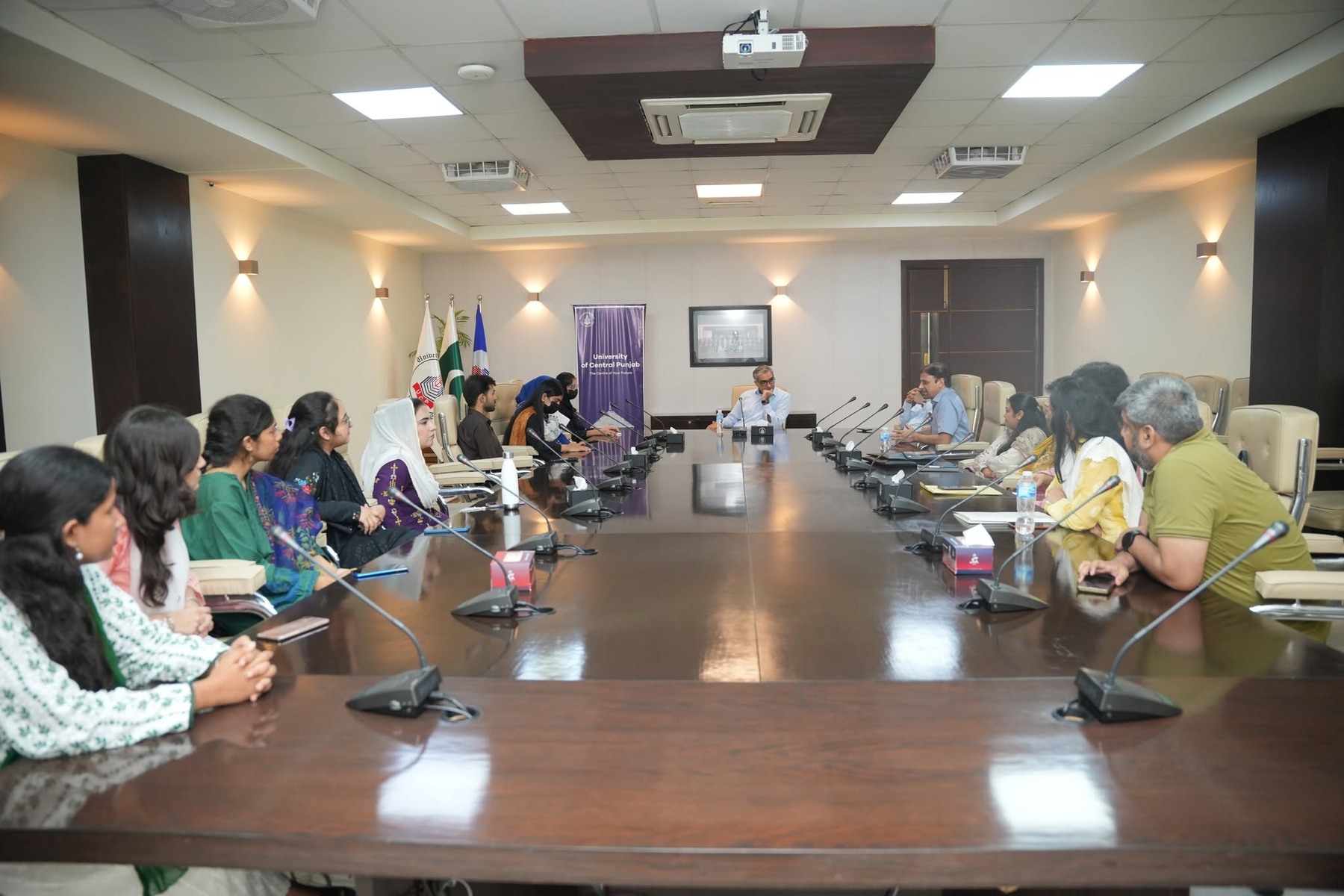 Students and faculty in discussion at the closing ceremony.