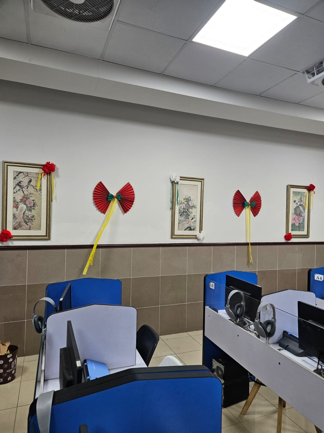 A classroom display with Chinese and Pakistani flags.