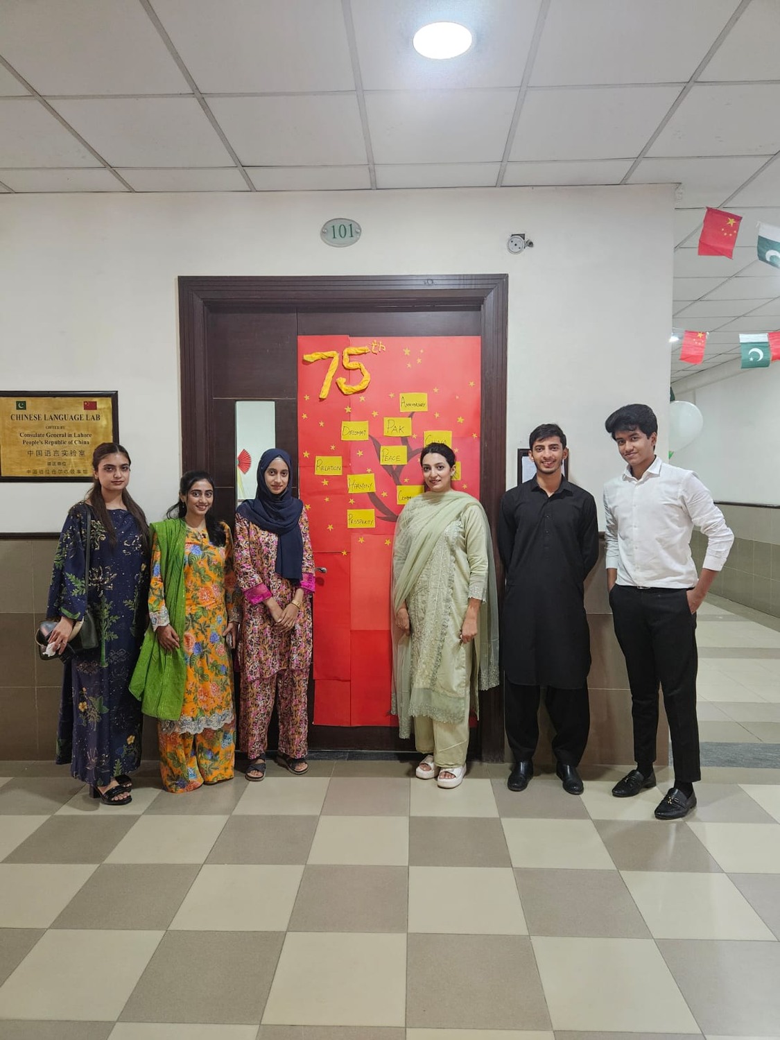 Participants beside a cultural display during the China celebration activities.
